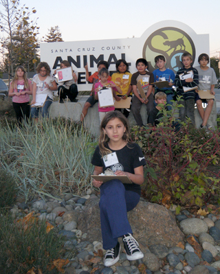 Students in front of animal shelter sign